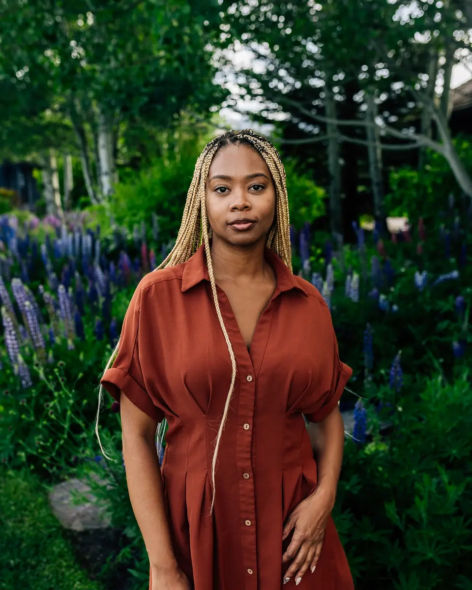 Portrait among flowers and mountains